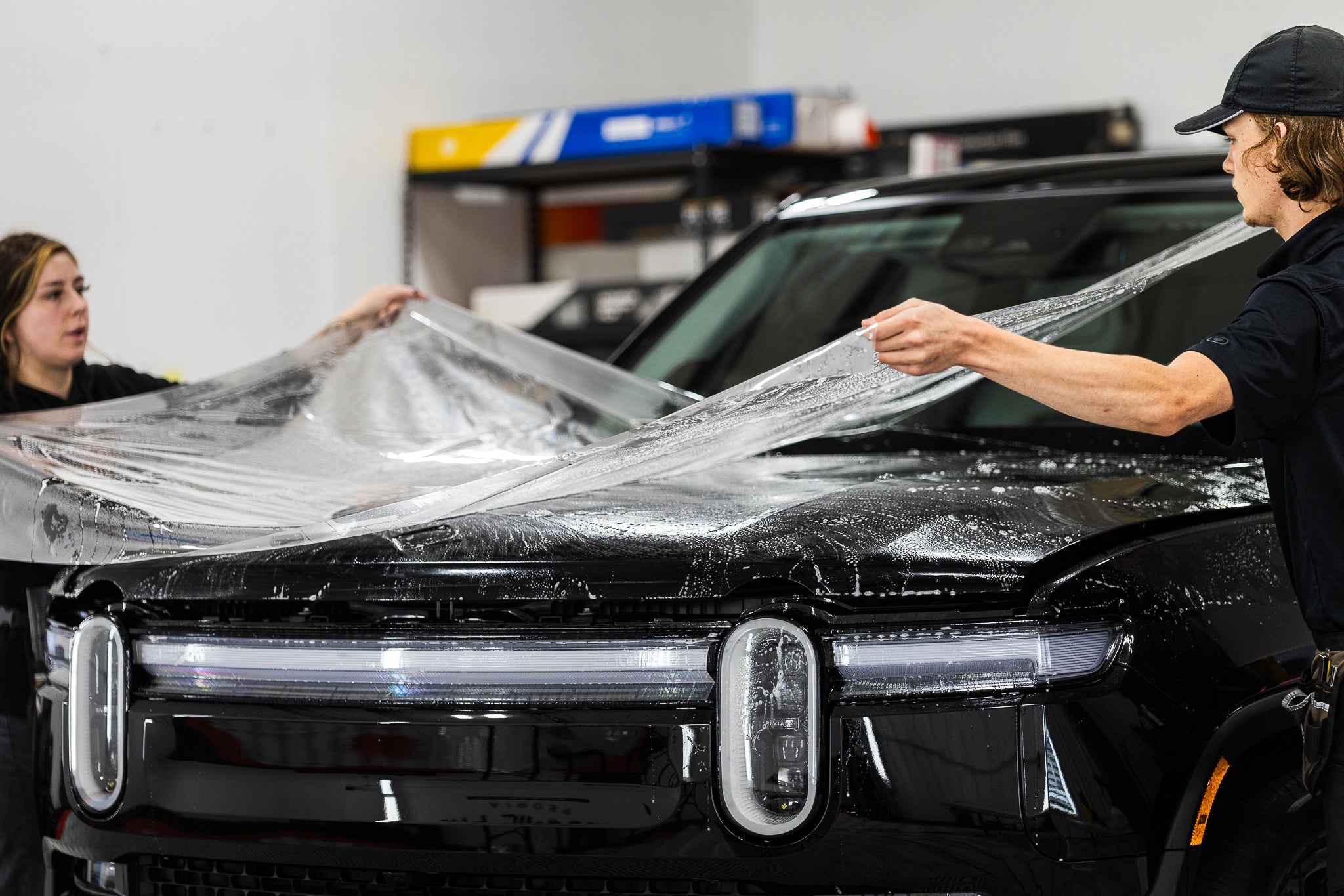PPF being installed on a Rivian